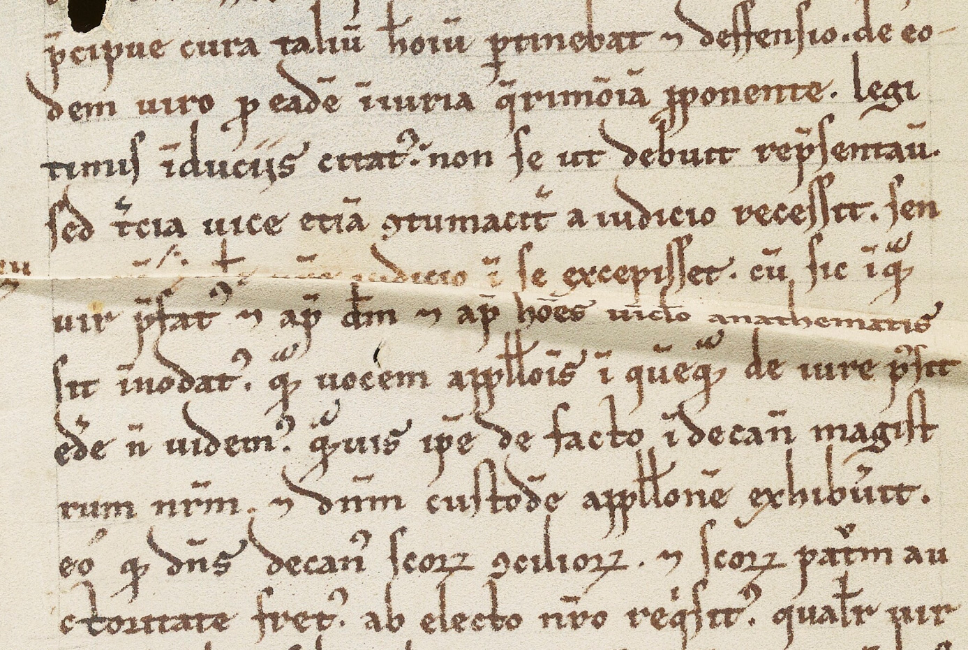 Distortions in parchment can disrupt the distribution of light in an image, like this crease in MS. Laud Lat. 41, though warping is often more subtle than this.